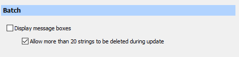 Trados Studio Batch settings window with two options: 'Display message boxes' unchecked and 'Allow more than 20 strings to be deleted during update' checked.