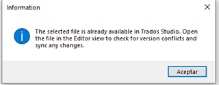 Information message in Trados Studio stating 'The selected file is already available in Trados Studio. Open the file in the Editor view to check for version conflicts and sync any changes.' with an Accept button.