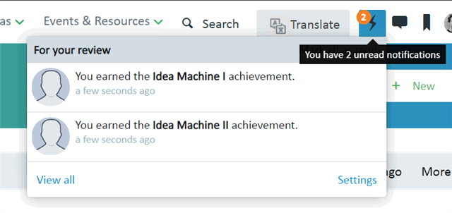 Notification pop-up in Trados Studio showing two messages: 'You earned the Idea Machine I achievement' and 'You earned the Idea Machine II achievement', both a few seconds ago.