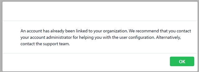 Error message in SDL Trados Live stating 'An account has already been linked to your organization. We recommend that you contact your account administrator for helping you with the user configuration. Alternatively, contact the support team.' with an OK button.